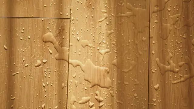 Water droplets on a wood plank floor